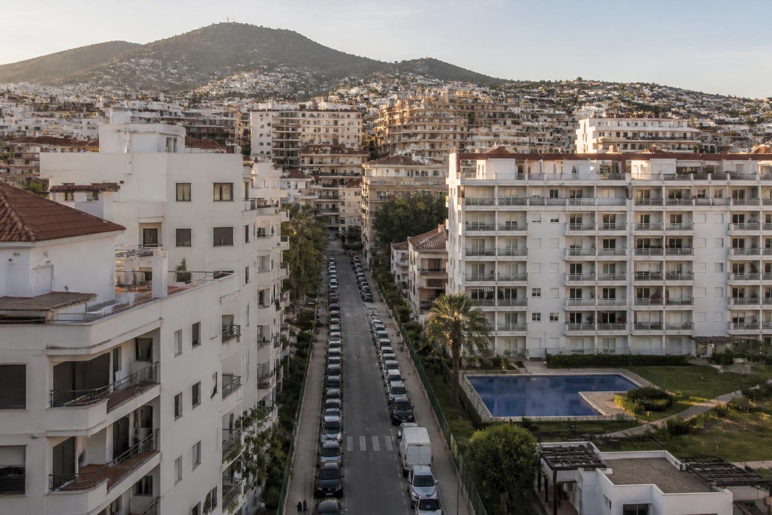 Dense residential apartment blocks with communal pool in Fuengirola, Costa del Sol