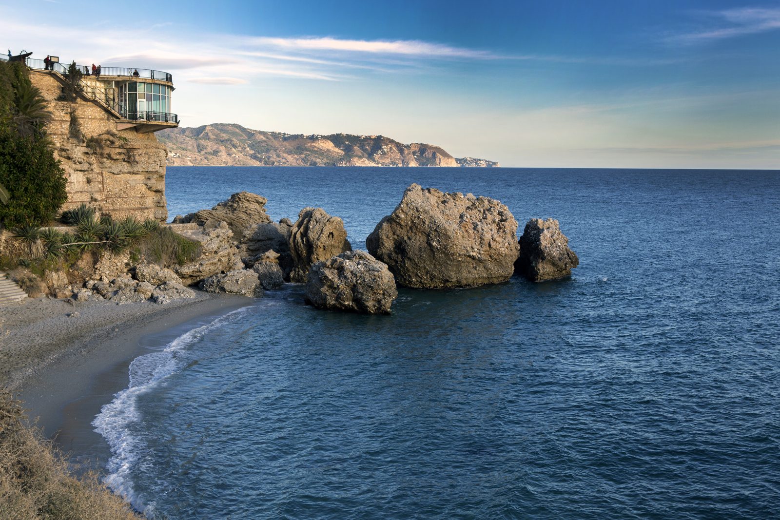 The Balcón de Europa mirador and Calahonda cove seen from the Nerja coastline, Andalucía, Spain